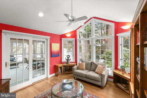 a spacious bathroom with a tub sink and mirror