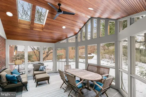 a view of an empty room and a window