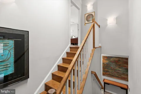 a view of a house with a yard covered in snow