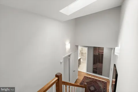 a front view of a house with a yard covered in snow