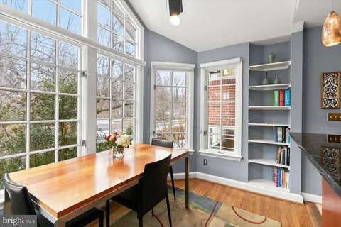 a living room with furniture a window and a chandelier