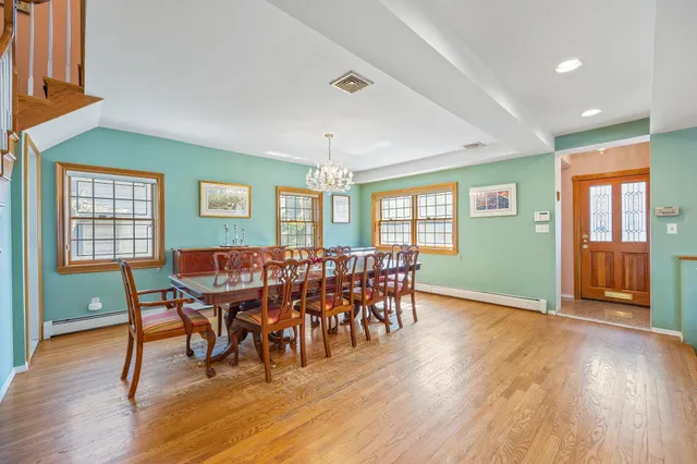 a dining room with furniture window wooden floor