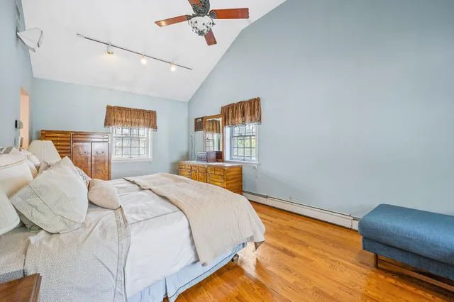 a bedroom with a bed and a chair