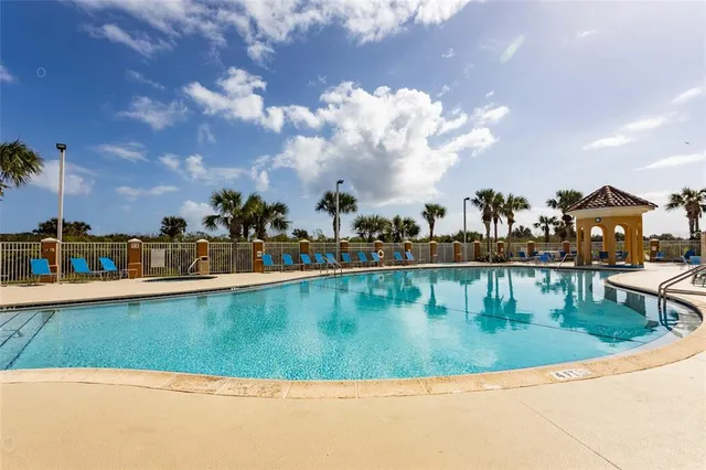 a view of swimming pool with outdoor seating