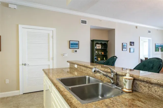 a kitchen with a sink and a refrigerator
