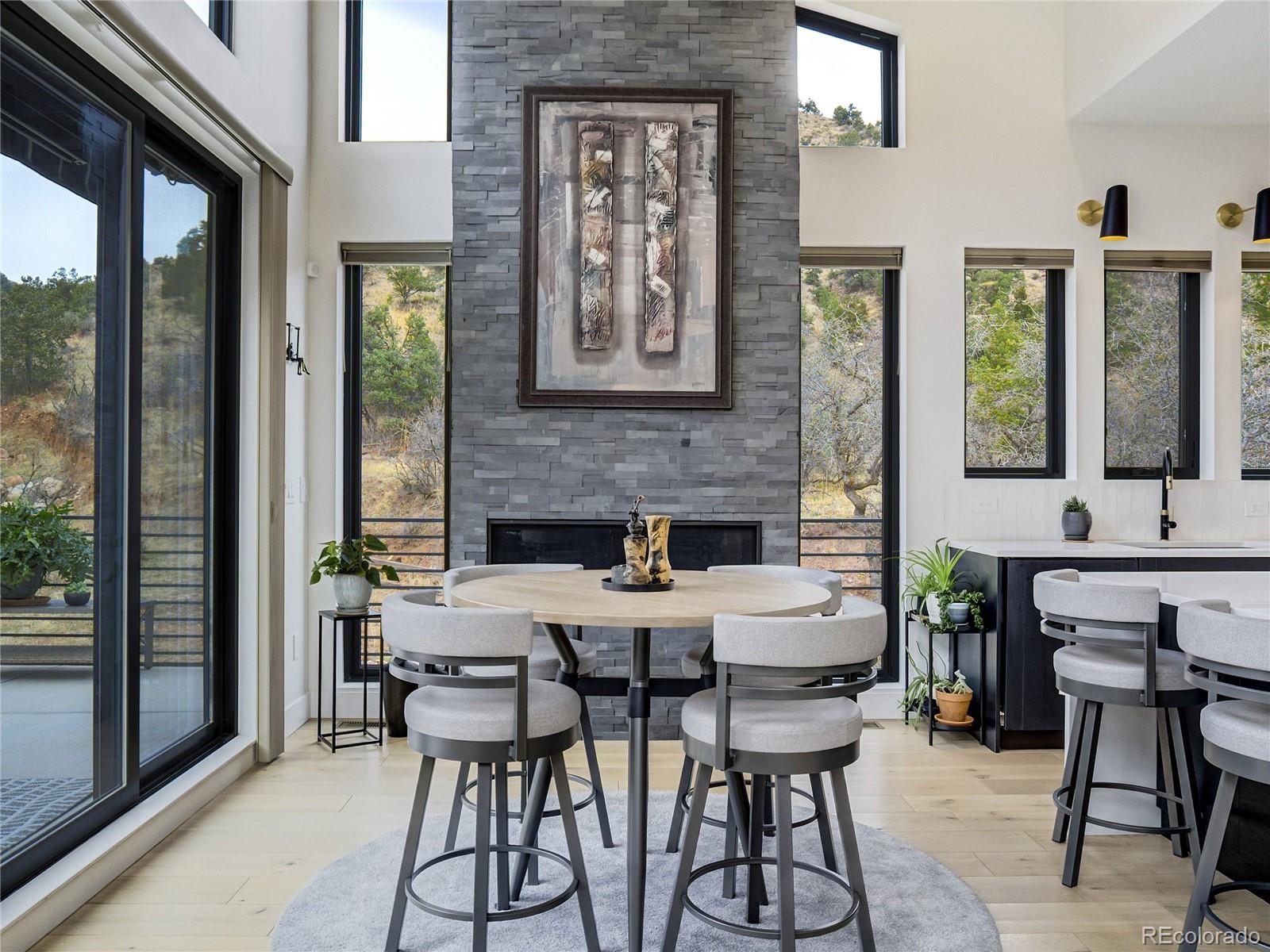 284 Crystal Park Road Manitou Springs, CO 80829 - Photo 14 of 39 a view of a dining room with furniture window and outside view