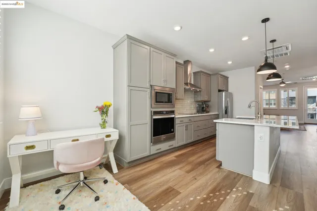 a large kitchen with stainless steel appliances