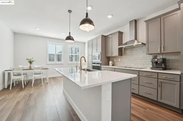 a view of a hallway with wooden floor and entryway
