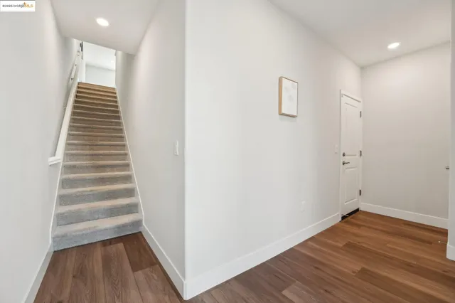 a bedroom with two beds and a window
