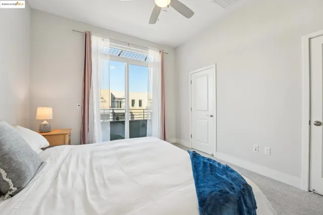 a view of city from balcony with seating area