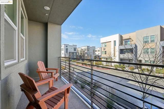 a living room with furniture a fireplace and a table