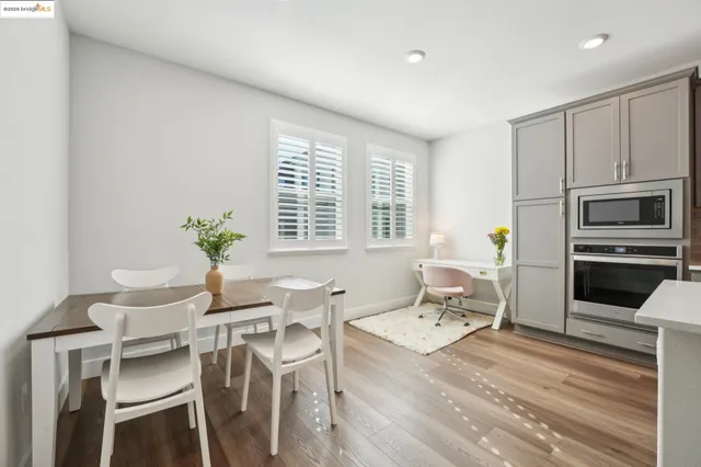 a white stove top oven sitting inside of a kitchen