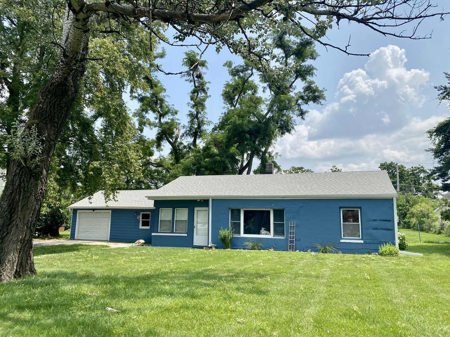6845 Willow Springs Road Countryside, IL 60525 - Photo 2 of 16 a front view of a house with a garden