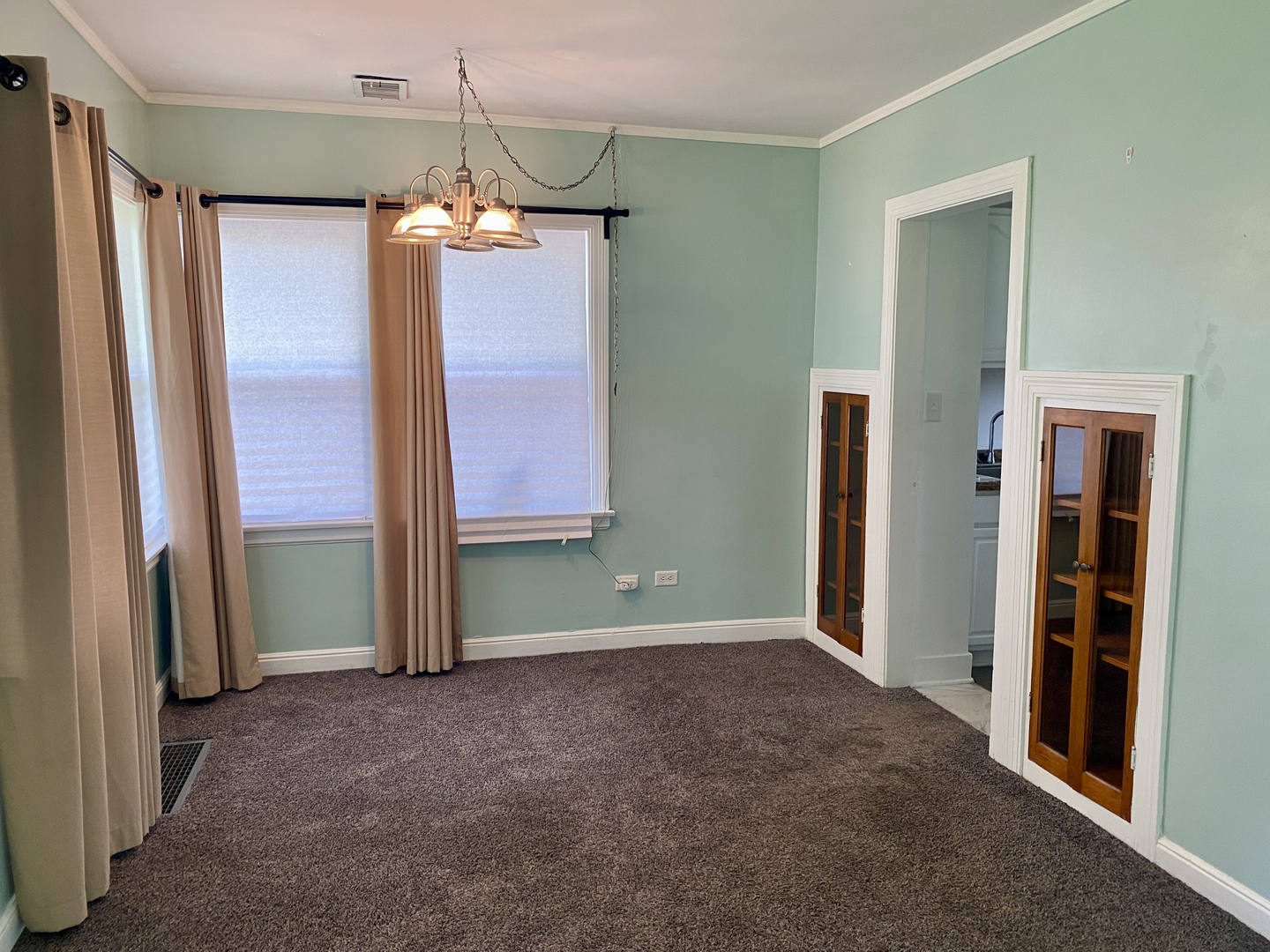 6845 Willow Springs Road Countryside, IL 60525 - Photo 5 of 16 a view of a kitchen with a refrigerator and cabinet