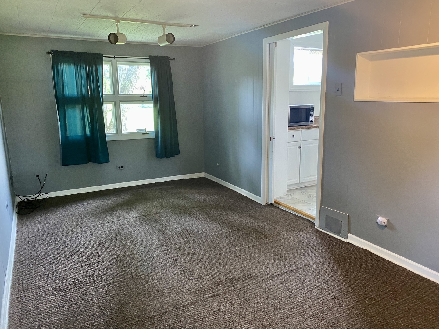 6845 Willow Springs Road Countryside, IL 60525 - Photo 8 of 16 an empty room with windows and entrance