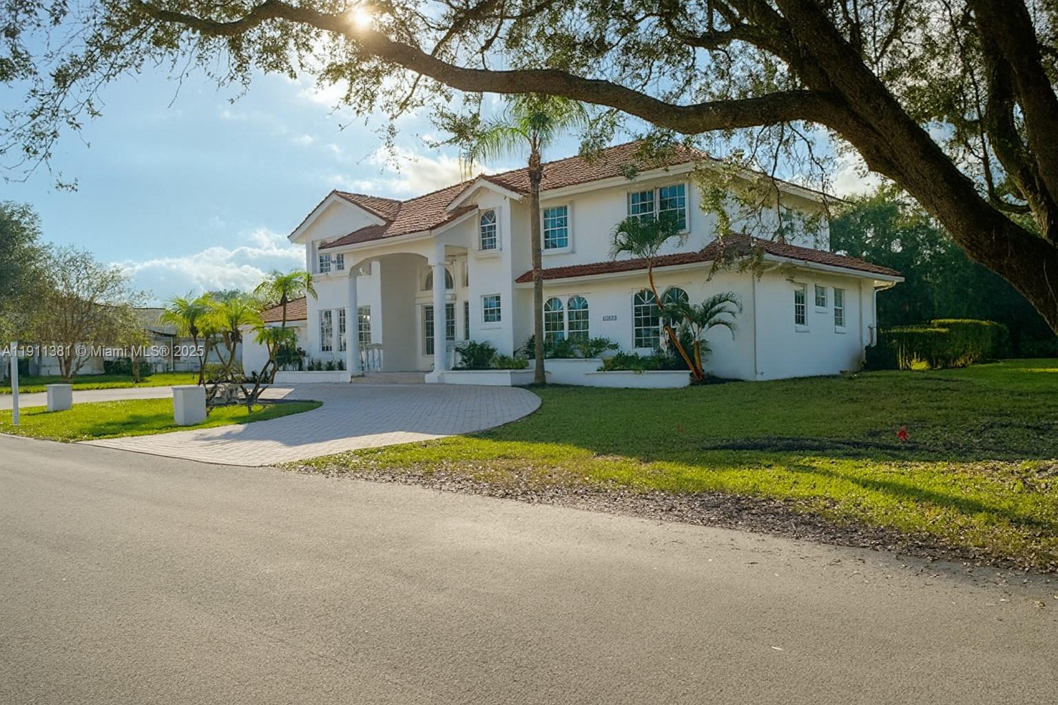 12360 Southwest 1st Street Plantation, FL 33325 - Photo 2 of 2 a view of house with outdoor space and yard