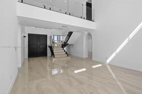 a kitchen with stainless steel appliances a refrigerator and a cabinets