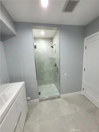 a bathroom with a shower and toilet