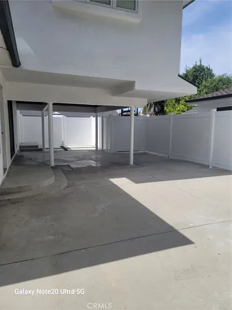 a view of a livingroom with wooden floor and garage