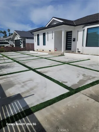 a view of a house with a sink and yard