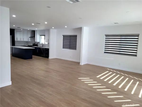 a kitchen with a refrigerator and a sink