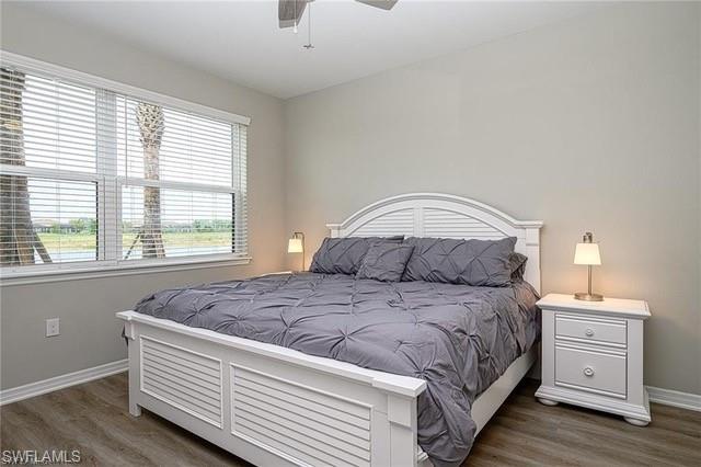 9365 Pocida Court, Unit 102 Naples, FL 34119 - Photo 20 of 38 a bedroom with a bed and a window