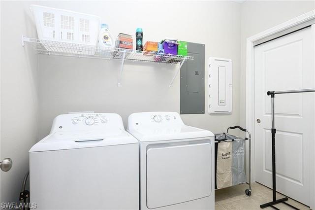 9365 Pocida Court, Unit 102 Naples, FL 34119 - Photo 23 of 38 a utility room with dryer and washer