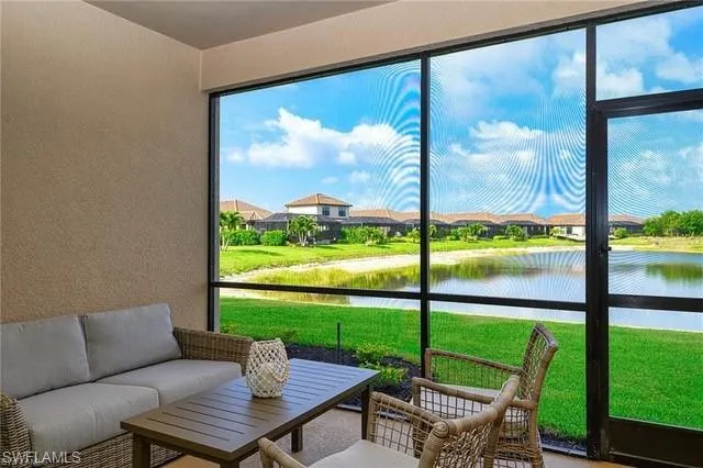 a living room with a large window and a table