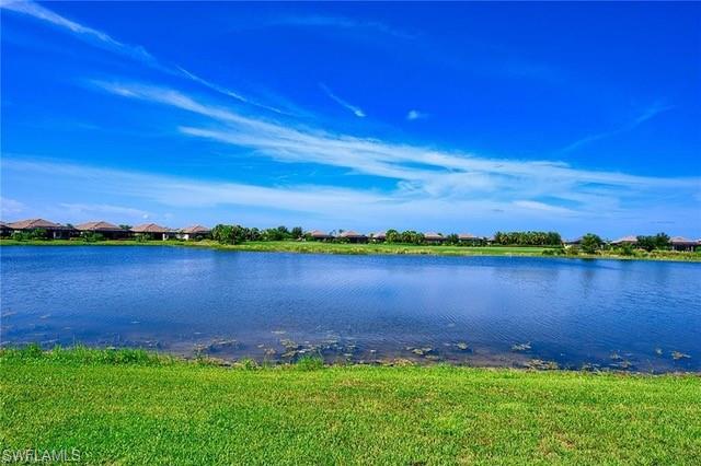 9365 Pocida Court, Unit 102 Naples, FL 34119 - Photo 26 of 38 a view of a lake with a city view