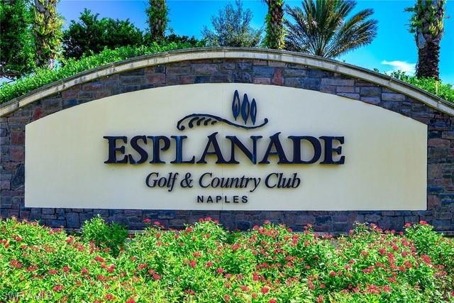 9365 Pocida Court, Unit 102 Naples, FL 34119 - Photo 28 of 38 a view of sign board with flower around