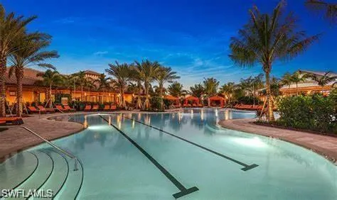 a view of swimming pool with outdoor seating