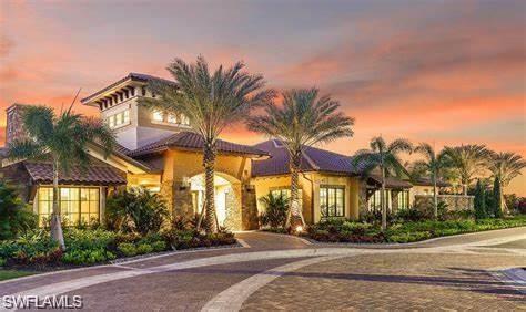 9365 Pocida Court, Unit 102 Naples, FL 34119 - Photo 33 of 38 a view of multiple house with palm trees