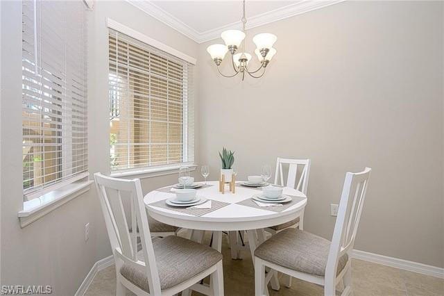 9365 Pocida Court, Unit 102 Naples, FL 34119 - Photo 9 of 38 a view of a dining room with furniture window and outside view