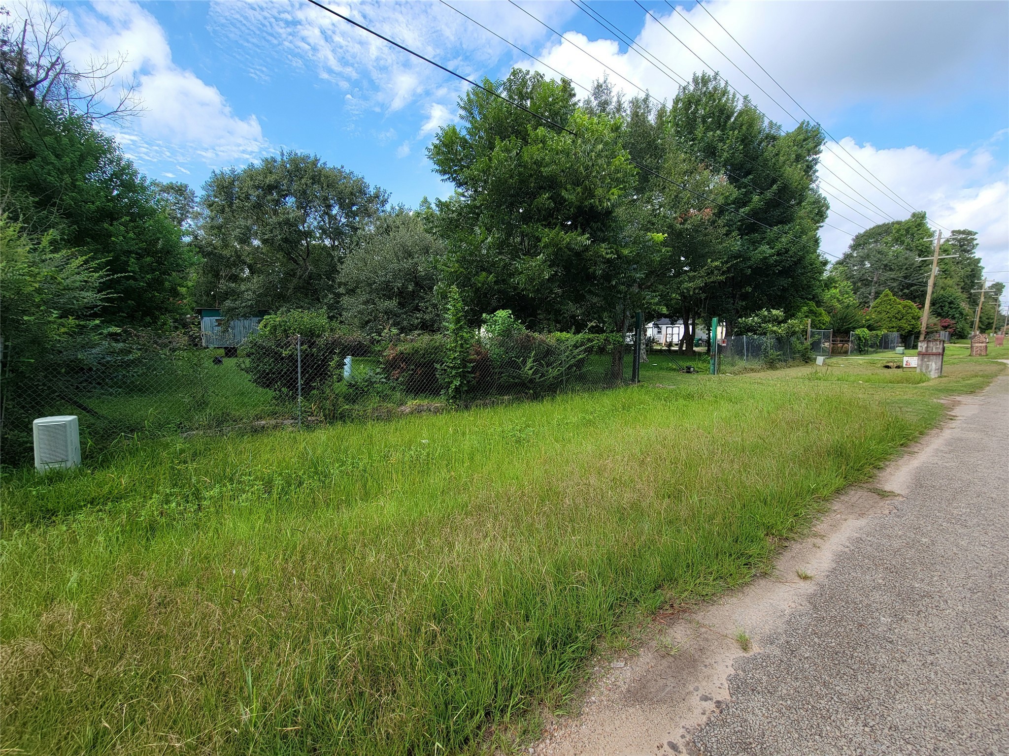 17590 Deer Run Road Conroe, TX 77306 - Photo 2 of 10 a view of a chair and table in the garden