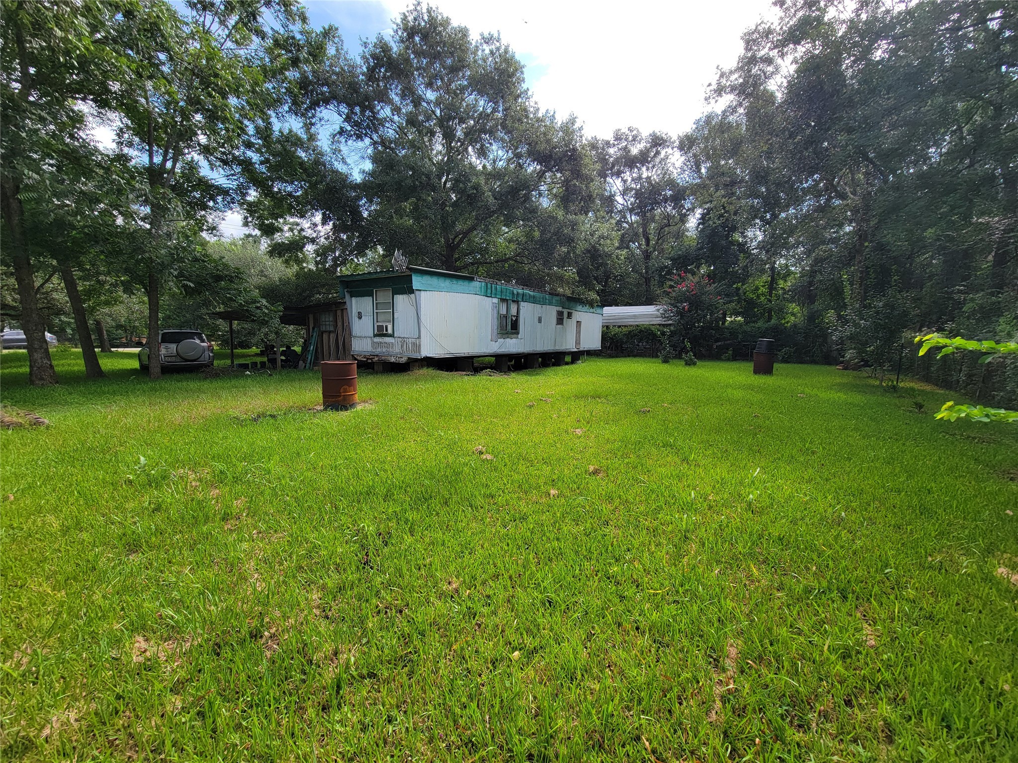 17590 Deer Run Road Conroe, TX 77306 - Photo 9 of 10 a house with a outdoor space