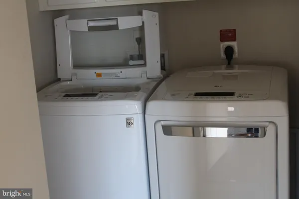 a utility room with washer and dryer