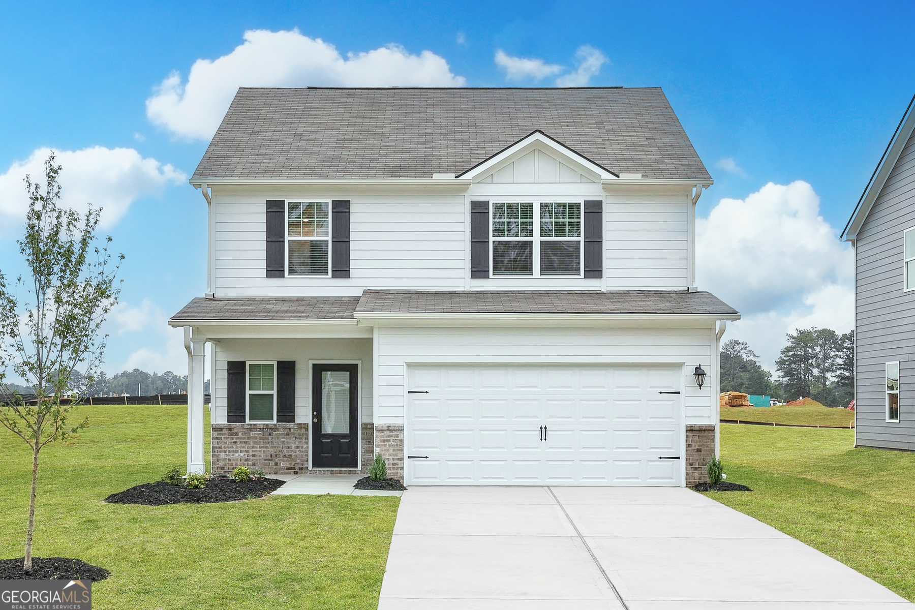 a front view of a house with a yard