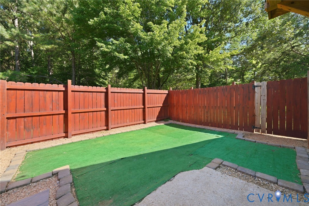 89 Old House Farm Road Bumpass, VA 23024 - Photo 49 of 67 Private backyard oasis featuring a spacious manicu