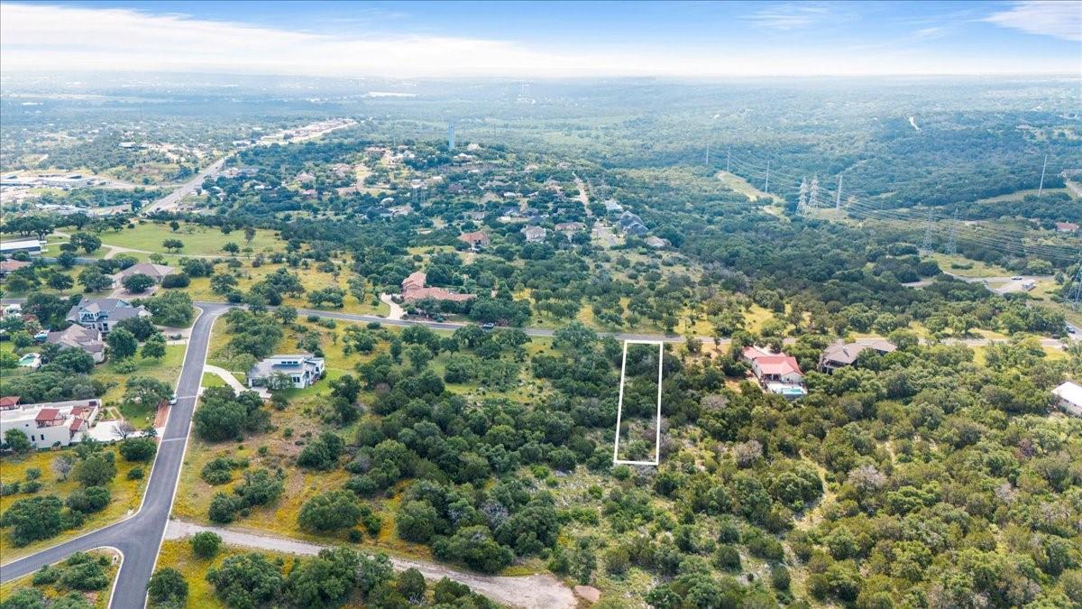 Lot 41118 Hi Ridge Road Horseshoe Bay, TX 78657 - Photo 3 of 10 A verdant aerial vista captures a secluded parcel, awaiting a custom dream home amidst the natural landscape.