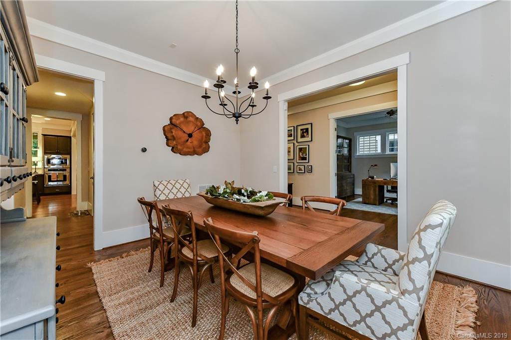 4935 Sharon View Road Charlotte, NC 28226 - Photo 11 of 48 a view of a dining room with furniture and chandelier