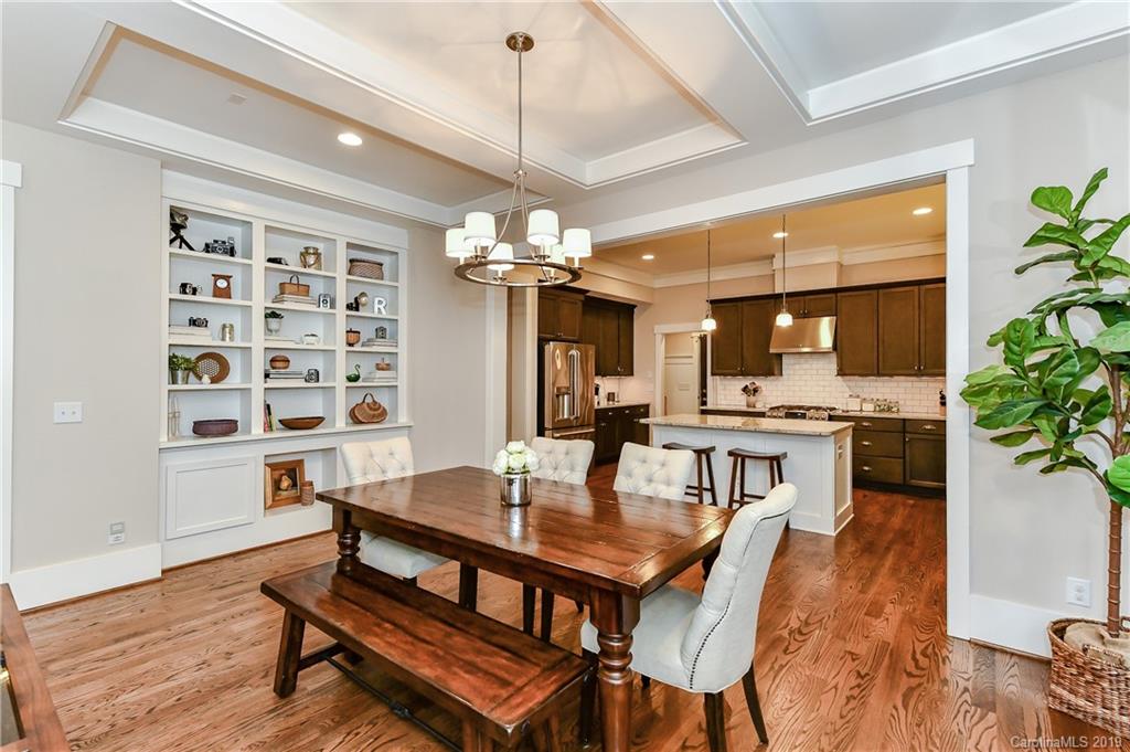 4935 Sharon View Road Charlotte, NC 28226 - Photo 14 of 48 a view of a dining room with furniture and wooden floor