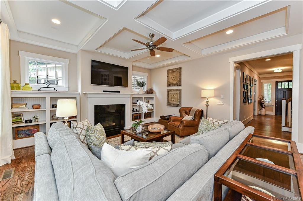 4935 Sharon View Road Charlotte, NC 28226 - Photo 25 of 48 a living room with furniture a flat screen tv and a fireplace