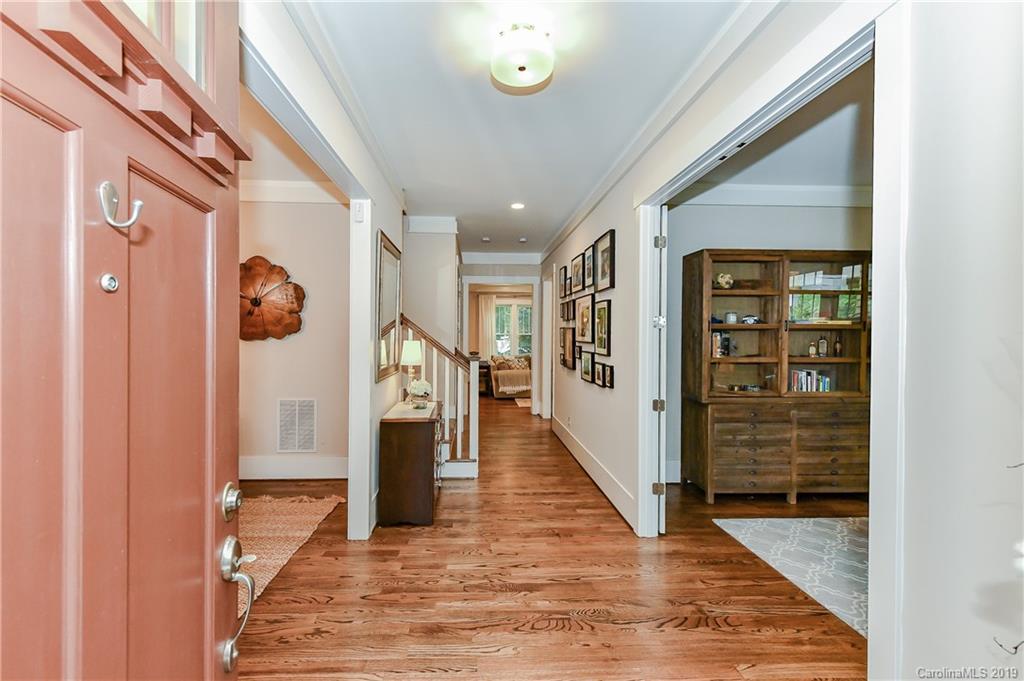 4935 Sharon View Road Charlotte, NC 28226 - Photo 4 of 48 a view of a hallway with wooden floor and staircase
