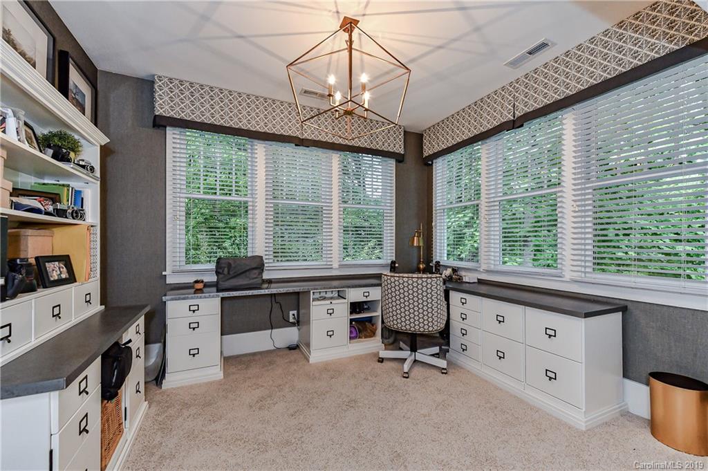 4935 Sharon View Road Charlotte, NC 28226 - Photo 31 of 48 a view of a workspace with furniture and a window