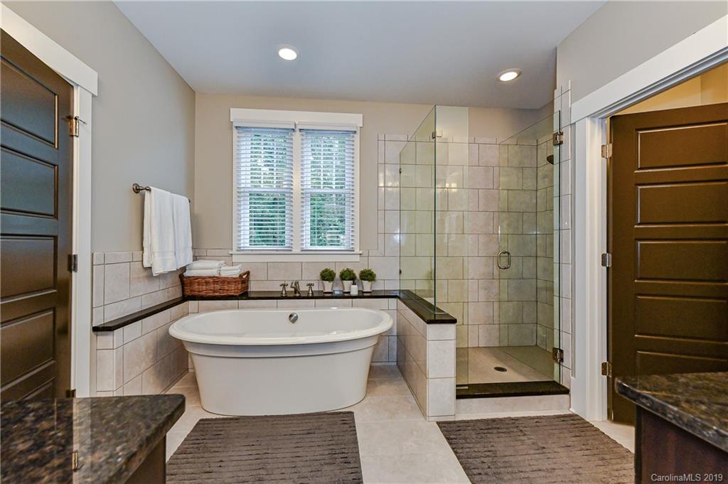 4935 Sharon View Road Charlotte, NC 28226 - Photo 34 of 48 a bathroom with a bathtub and shower