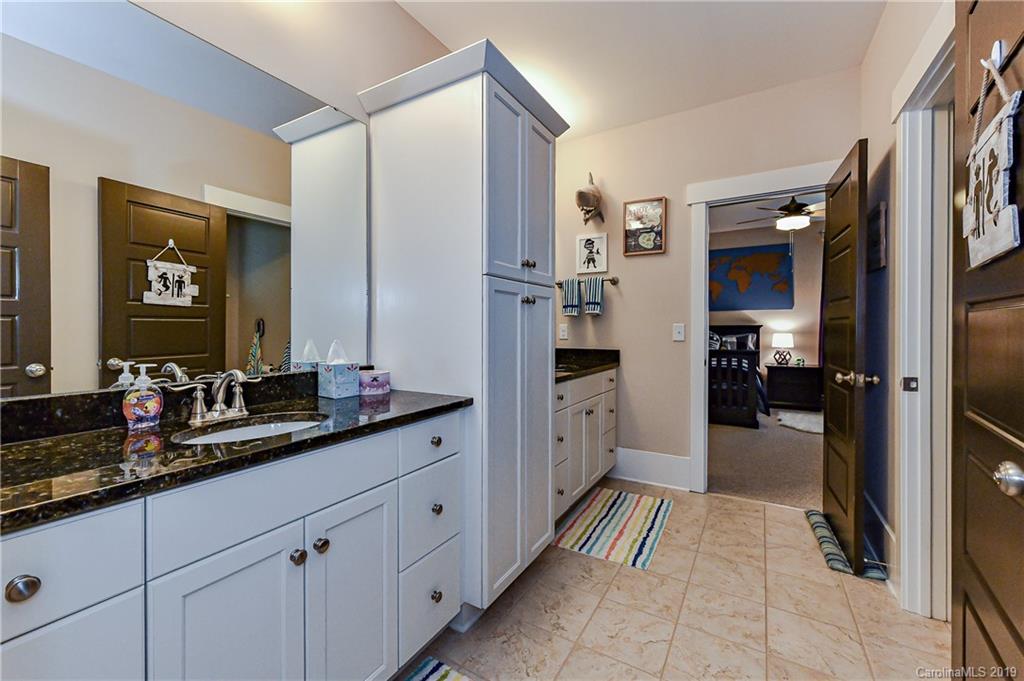 4935 Sharon View Road Charlotte, NC 28226 - Photo 40 of 48 a large white kitchen with a sink and refrigerator