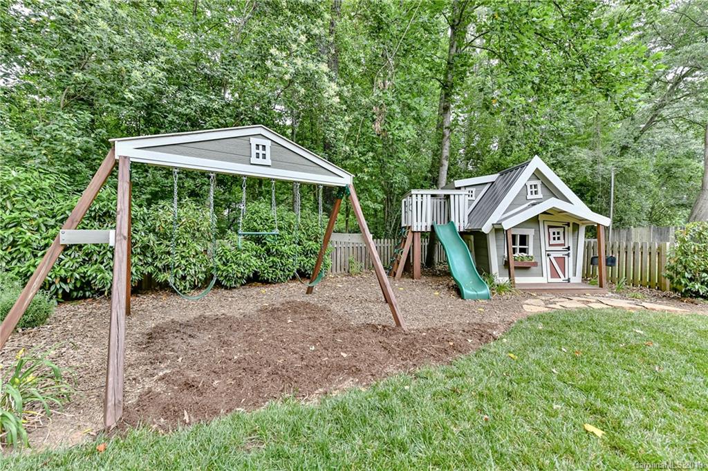 4935 Sharon View Road Charlotte, NC 28226 - Photo 46 of 48 a front view of a house with a yard and porch