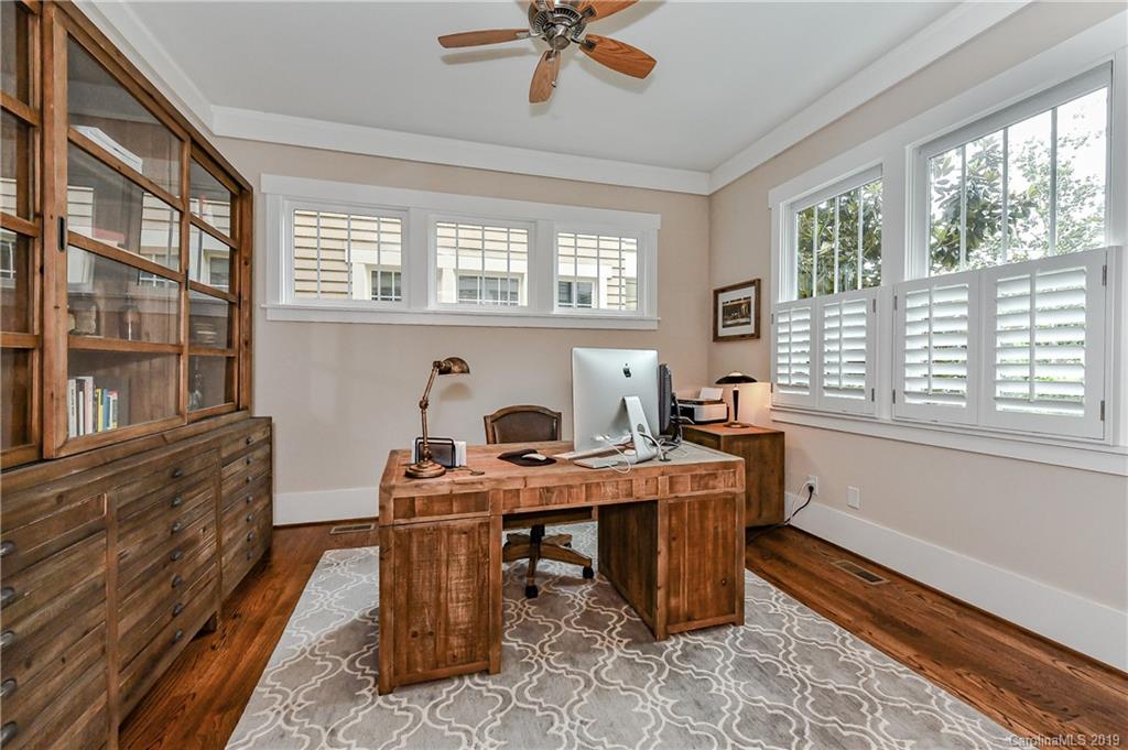 4935 Sharon View Road Charlotte, NC 28226 - Photo 7 of 48 a view of a workspace with furniture and a window