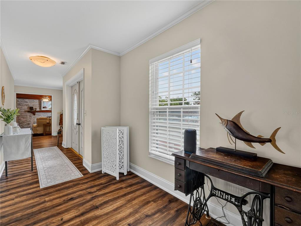 4615 Kings Point Court Lakeland, FL 33813 - Photo 2 of 41 a view of a workspace with furniture and a window
