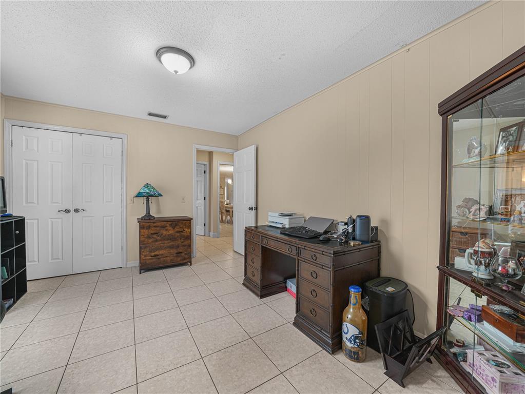 4615 Kings Point Court Lakeland, FL 33813 - Photo 26 of 41 a view of workspace with furniture and cabinet